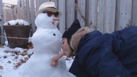 Fuck snowman in the yard of house