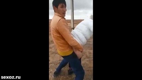 Uzbeks fuck a mature whore behind the village