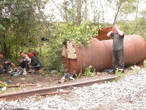 Horny older woman with red hair fucks 3 homeless men at their camp in woods