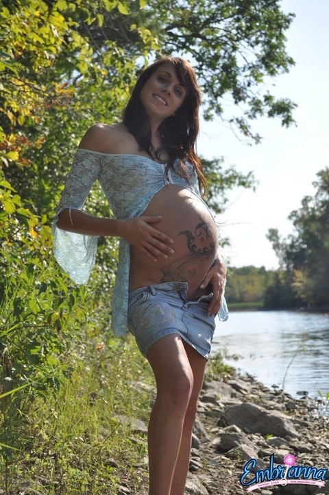 Pregnant girl Brianna strips to flat shoes on a riverbank in a serene setting | Фото 3