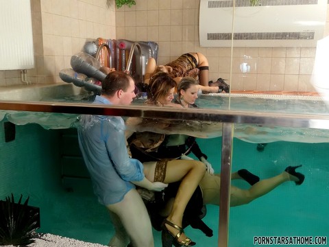 Kinky females pile into an indoor pool for a reverse gangbang with clothes on | Фото 10