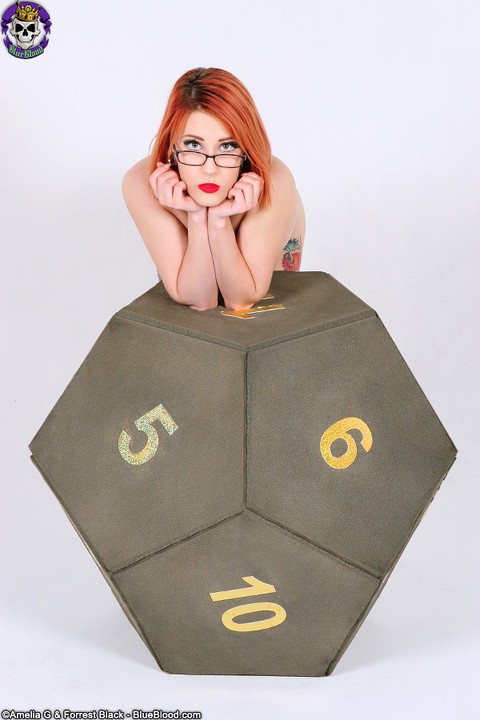 Inked redhead Anastassia Bear poses nude in glasses on a gamer's cube | Фото 8