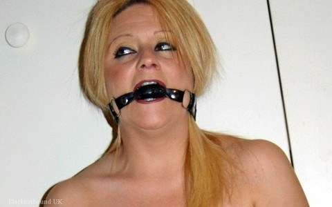 Natural blonde Adrienna loses a ball gag for a brief moment to give head | Фото 14