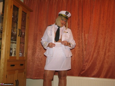 Thick blonde Chrissy Uk exposes her tits while wearing her uniform | Фото 11