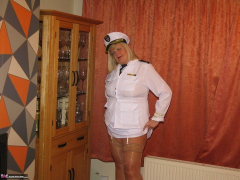 Thick blonde Chrissy Uk exposes her tits while wearing her uniform | Фото 5