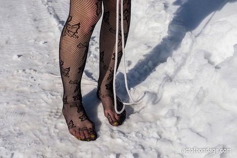 White female is toed up and forced to stand and kneel in snow | Фото 4