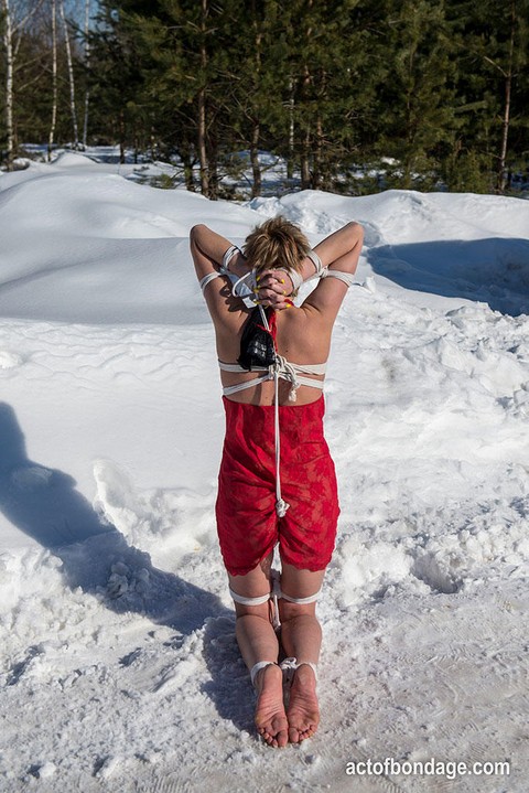 White female is toed up and forced to stand and kneel in snow | Фото 7