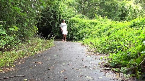 Solo female Chloe Lamour takes a piss on a paved path while wearing sandals | Фото 1