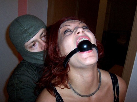 Redhead girl Lilu is tied up and silenced before being fitted with a ball gag | Фото 14