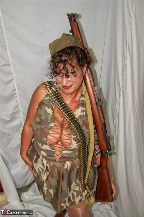 Overweight mature woman exposes her garters and nylon tops in military apparel | Фото 6