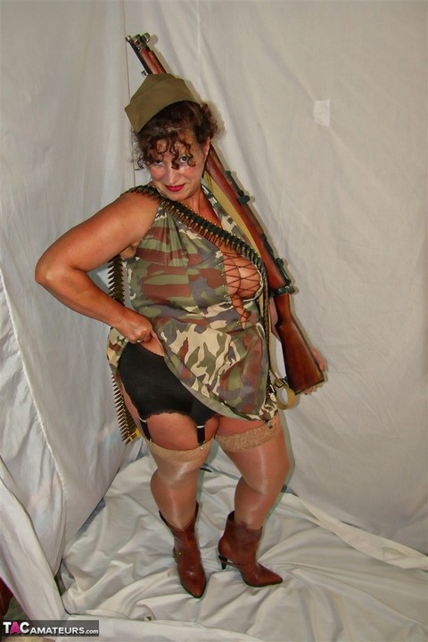 Overweight mature woman exposes her garters and nylon tops in military apparel | Фото 8