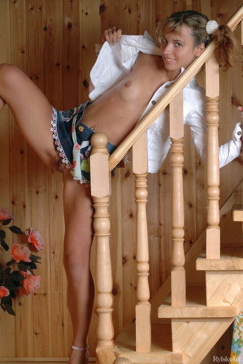 Pigtailed teen babe Natalia B exposing her pussy in an upskirt on the stairs | Фото 10