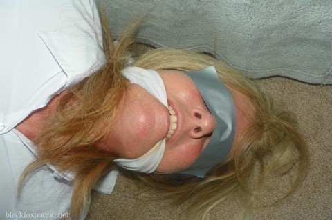 Blonde woman is cleave gagged and hogtied in a white blouse and blue jeans | Фото 13