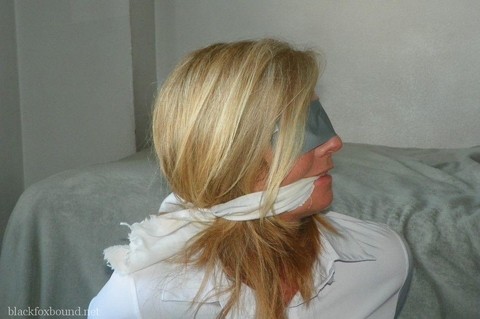 Blonde woman is cleave gagged and hogtied in a white blouse and blue jeans | Фото 9