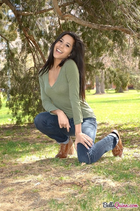 Latina chick Bella Quinn climbs a tree in the park wearing a sweater and jeans | Фото 5