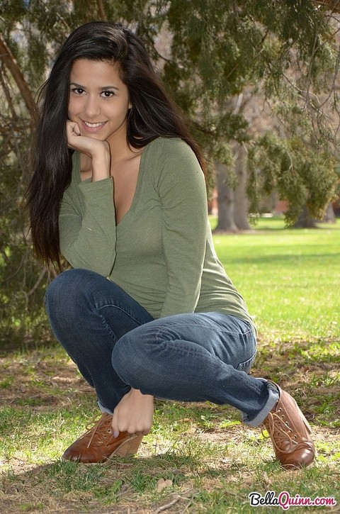 Latina chick Bella Quinn climbs a tree in the park wearing a sweater and jeans | Фото 7