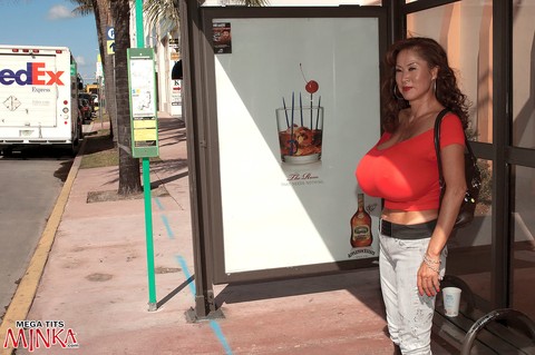 Older Asian lady Minka fills out her tops with massive tits in non nude action | Фото 15