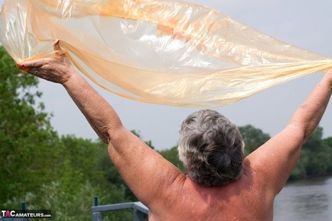 Obese oma Grandma Libby doffs a see-through raincoat to get naked on a bridge | Фото 18