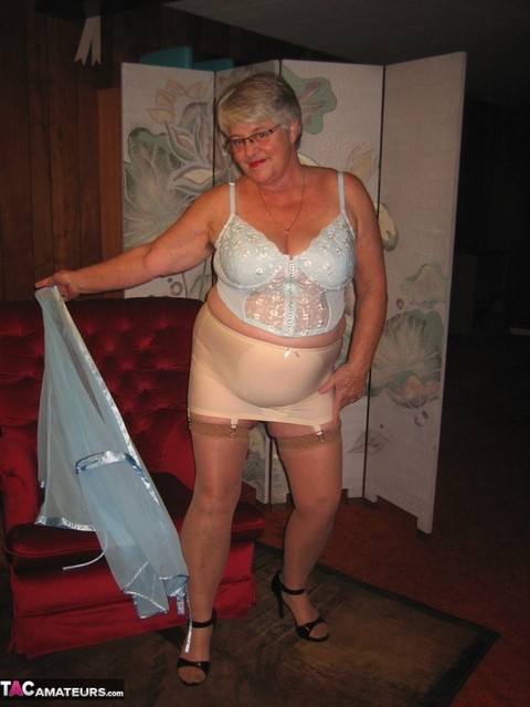 Obese nan Girdle Goddess uncrosses nylon clad legs to expose her twat