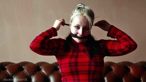 Blonde female straps on a cleave gag before hogtying herself on a couch | Фото 11