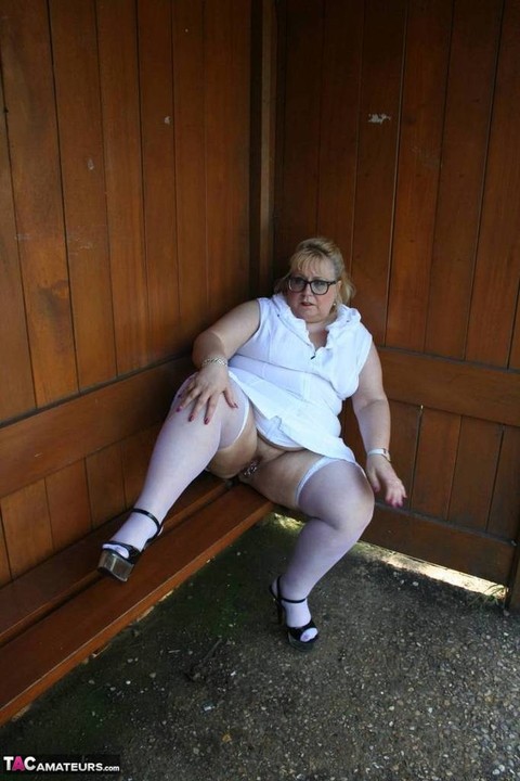 Fat blonde woman Lexie Cummings exposes herself in a public bus shelter