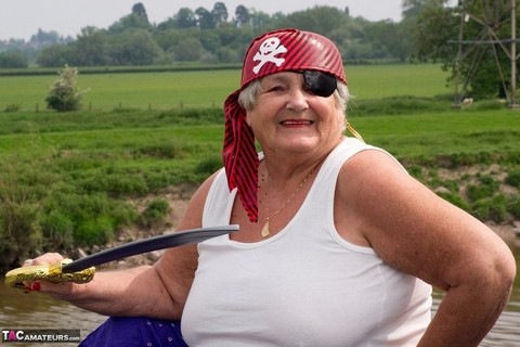 Fat British granny exposes herself on a bridge while sporting pirate attire | Фото 1