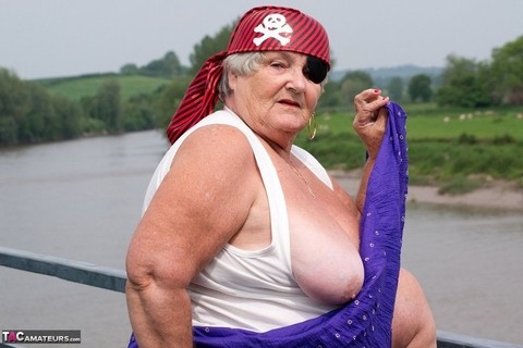 Fat British granny exposes herself on a bridge while sporting pirate attire | Фото 10