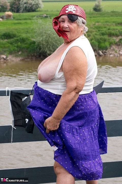 Fat British granny exposes herself on a bridge while sporting pirate attire | Фото 12