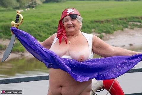 Fat British granny exposes herself on a bridge while sporting pirate attire | Фото 14