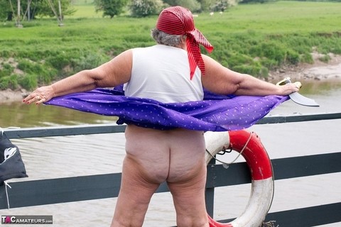 Fat British granny exposes herself on a bridge while sporting pirate attire | Фото 15