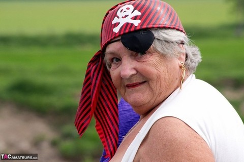 Fat British granny exposes herself on a bridge while sporting pirate attire | Фото 16