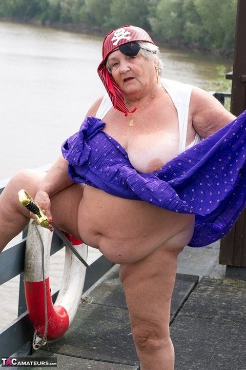 Fat British granny exposes herself on a bridge while sporting pirate attire | Фото 17