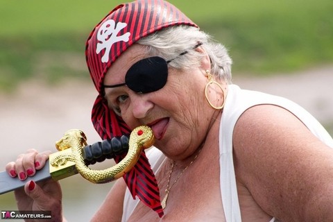 Fat British granny exposes herself on a bridge while sporting pirate attire | Фото 18