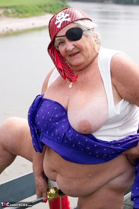 Fat British granny exposes herself on a bridge while sporting pirate attire | Фото 19