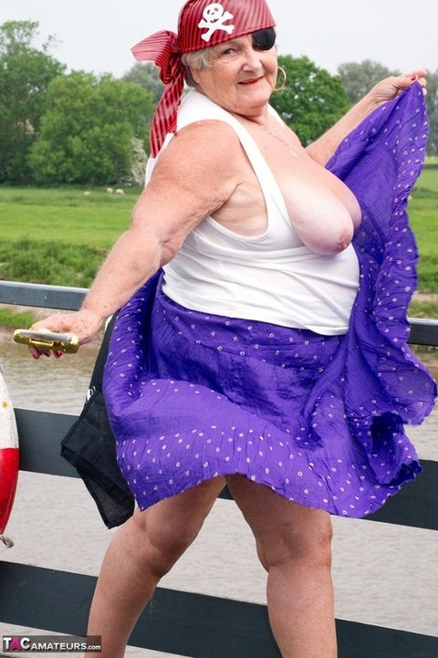 Fat British granny exposes herself on a bridge while sporting pirate attire | Фото 3