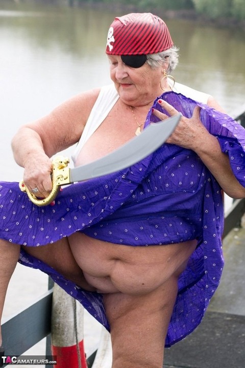 Fat British granny exposes herself on a bridge while sporting pirate attire | Фото 5