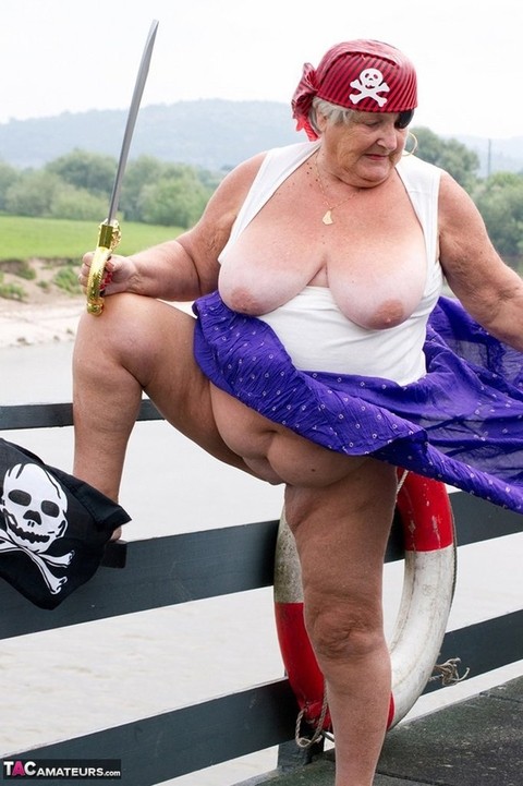 Fat British granny exposes herself on a bridge while sporting pirate attire | Фото 6