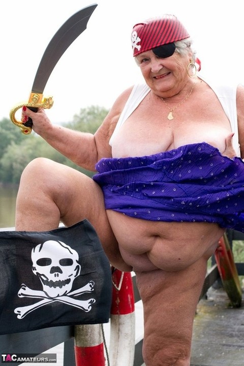 Fat British granny exposes herself on a bridge while sporting pirate attire | Фото 7