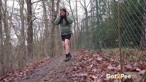 White girl Ali Bordeaux squats for a piss against a fence in a winter coat | Фото 14