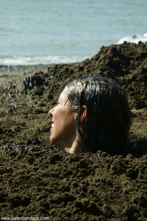 Bound slut with big boobs Sasha Sparks gets buried in mud by her lezdom