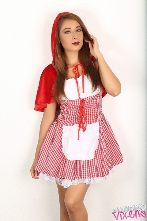 Cute girl Lilly flashes a no panty upskirt in Little Red Riding Hood outfit | Фото 1