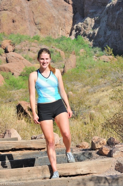 Sweet teen Emilie doffs her black shorts & stretches half naked on a yoga mat | Фото 1