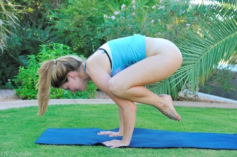 Sweet teen Emilie doffs her black shorts & stretches half naked on a yoga mat | Фото 13