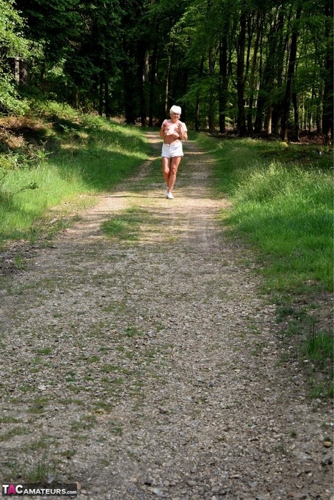 Mature amateur Dimonty stands naked in sneakers after jogging in the woods | Фото 14