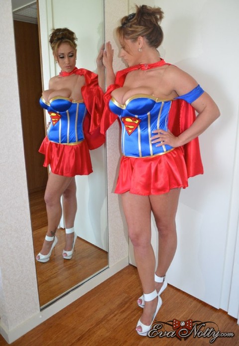 Sexy MILF Eva Notty sports cum on her tits while removing a Superman costume | Фото 10