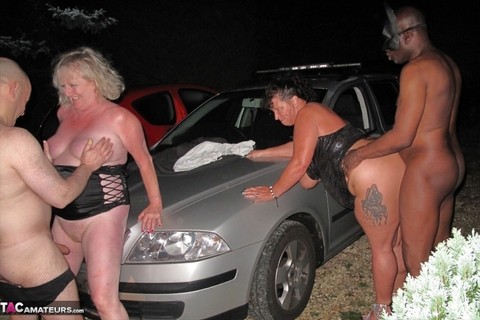 Overweight mature women take part in group sex over car bonnets