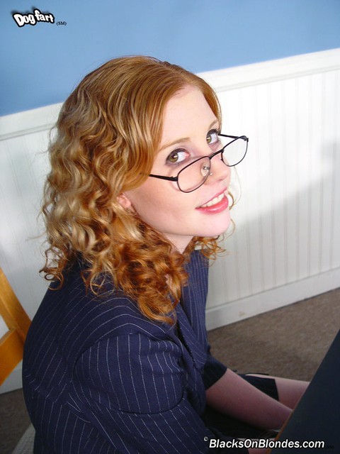 Horny ginger in glasses Cherry Poppens kneels to suck black cock