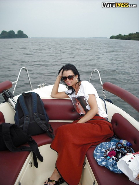 Full-bosomed brunette babe gets rid of her clothes at the boat tour