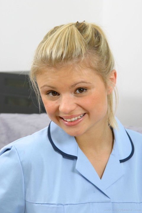 Slutty nurse Jak doffs her uniform to show her sweet tits in white stockings | Фото 1