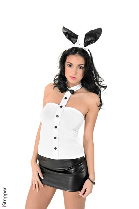 Hot brunette in bunny ears and a short skirt Foxxi Black does a striptease | Фото 5